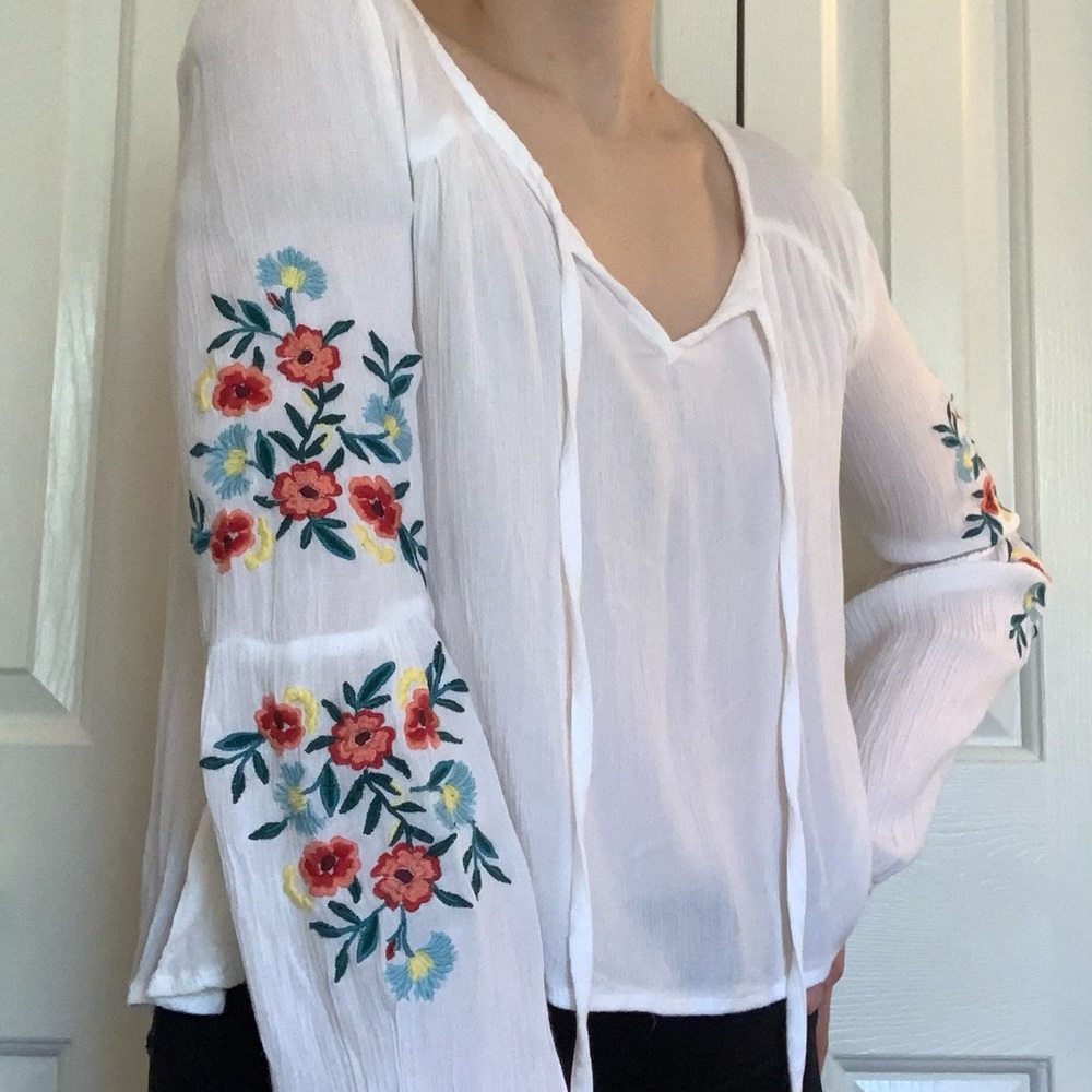 White blouse with floral embroidery